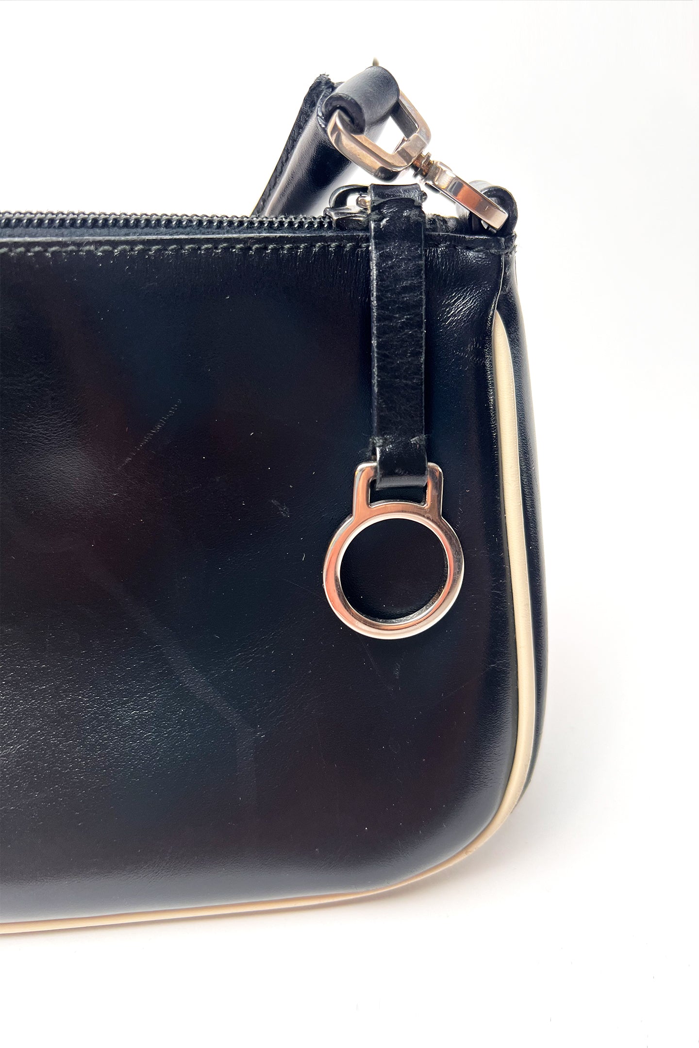 Vintage 2000s black Prada leather shoulder bag with white trims