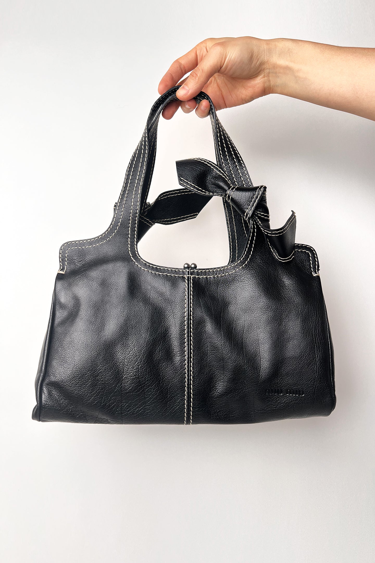 Vintage 90s Rare Miu Miu bow tie black leather shoulder bag with white stitches
