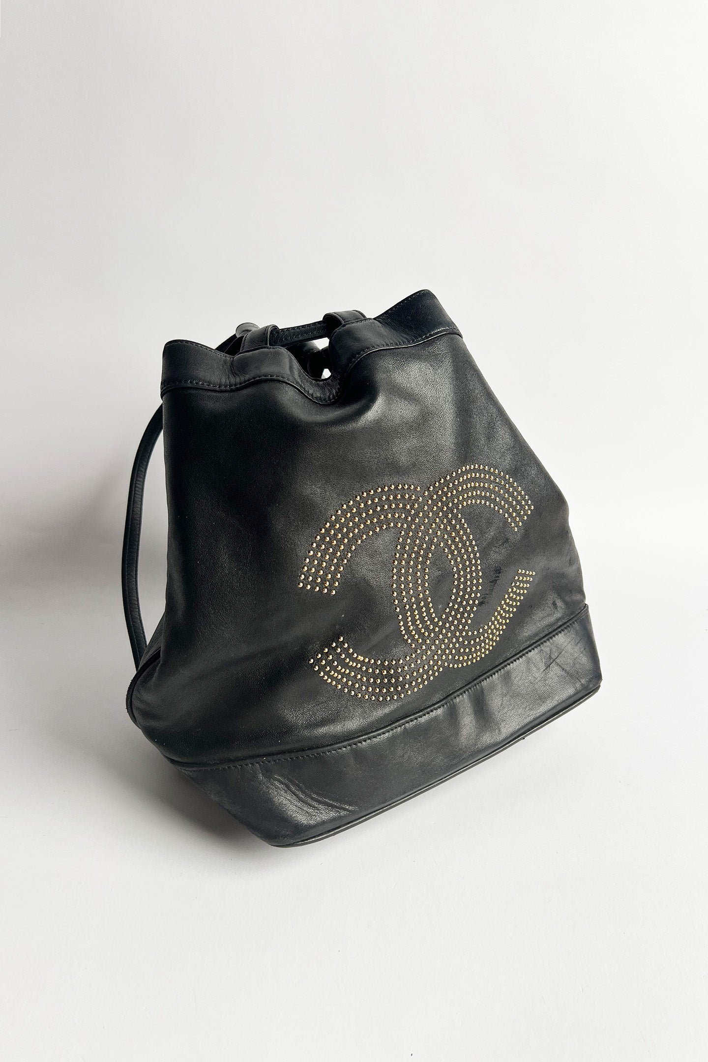 Vintage lamb leather Chanel bucket bag with studded logo