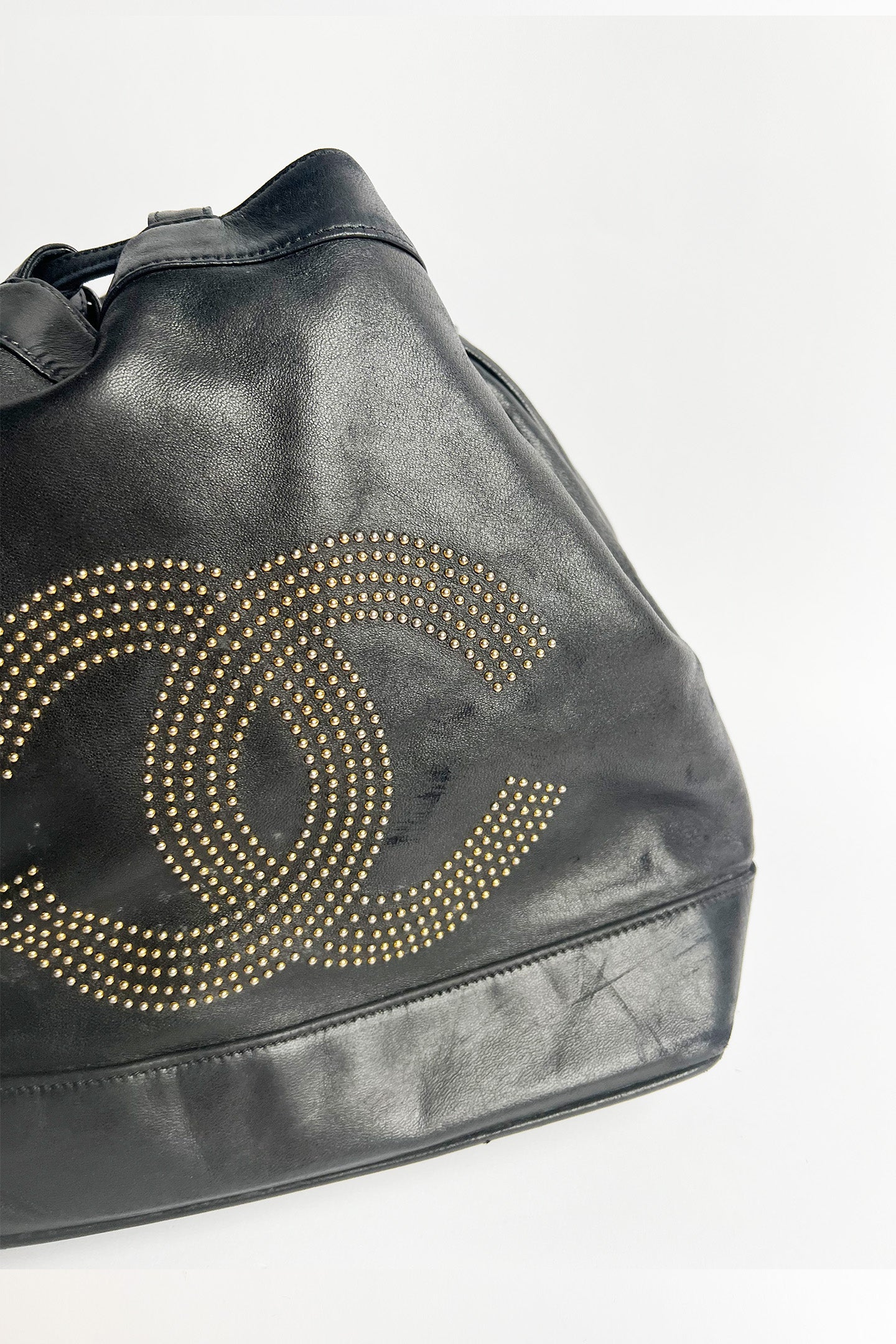 Vintage lamb leather Chanel bucket bag with studded logo