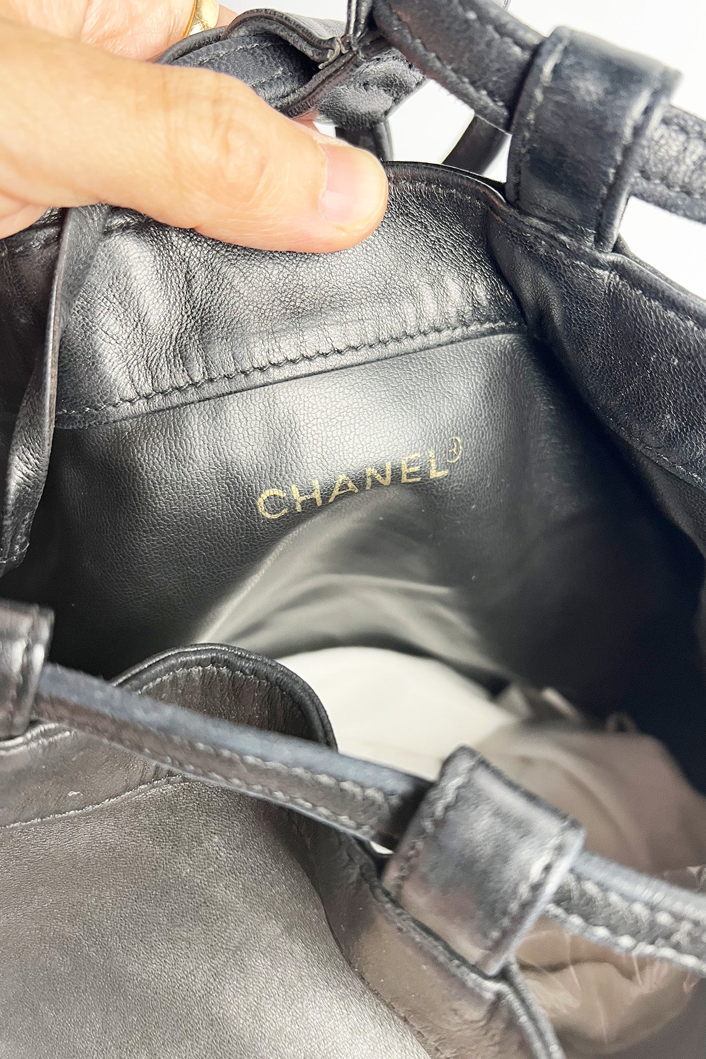 Vintage lamb leather Chanel bucket bag with studded logo