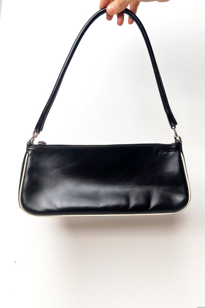 Vintage 2000s black Prada leather shoulder bag with white trims