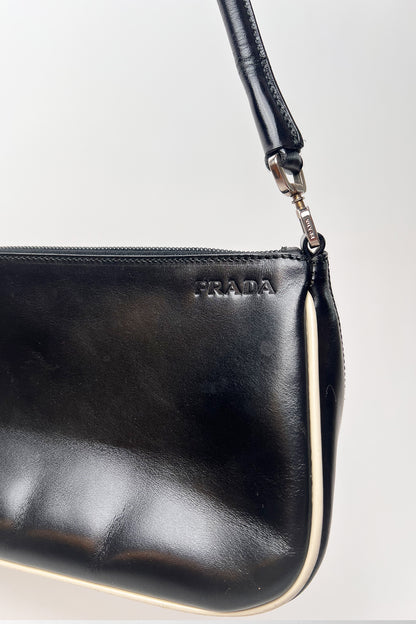 Vintage 2000s black Prada leather shoulder bag with white trims