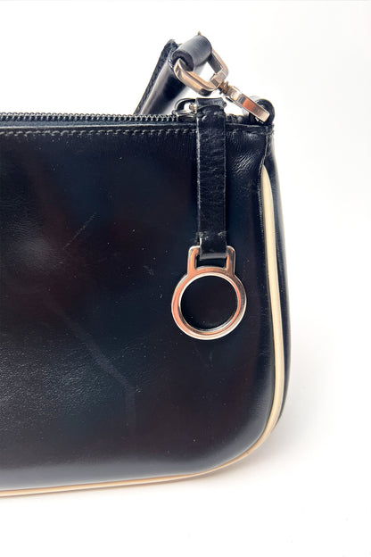 Vintage 2000s black Prada leather shoulder bag with white trims